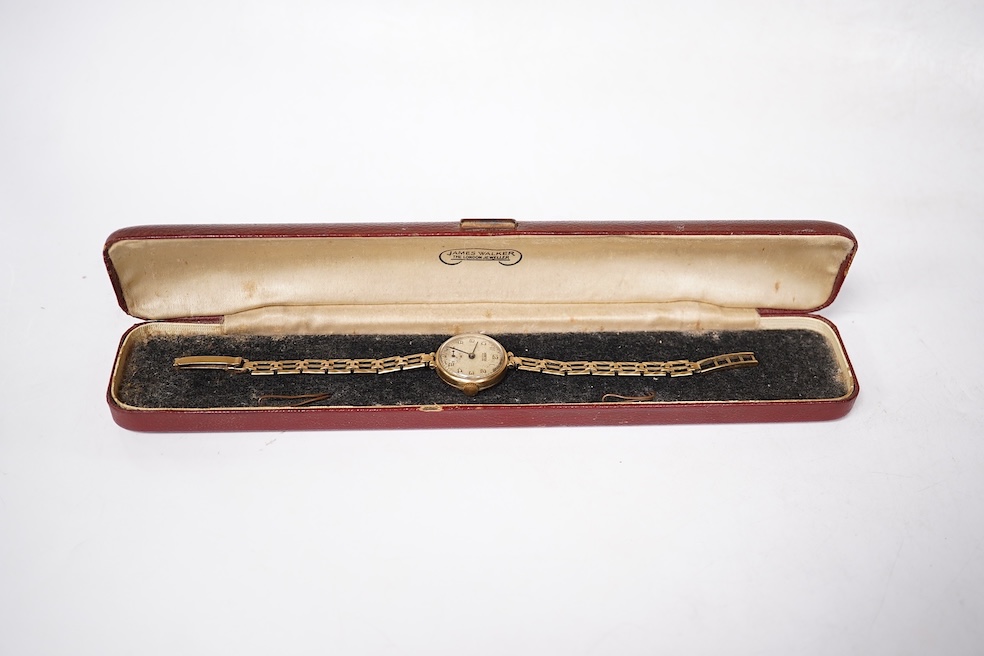 A lady's 9ct gold Vertex manual wind wrist watch, with Arabic dial and subsidiary seconds, on a 9ct gold associated bracelet, gross weight 15 grams. Condition - poor